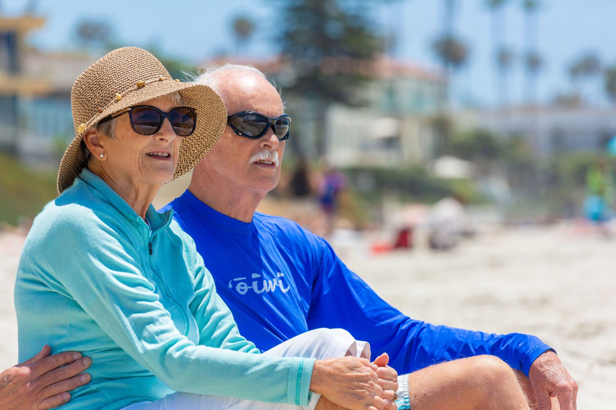 Man and woman sitting together on a beach